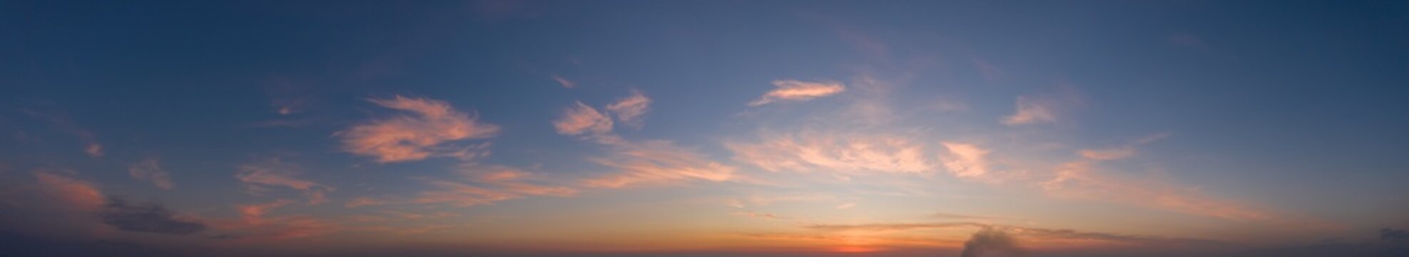 Colorful sky with cirrus clouds during dawn. High resolution panorama. View from above