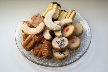 Group of delicious sweet Christmas cookies, white vanilla rolls, gingerbread, linzer and chocolate sweets wiht jam filling