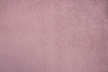 Fototapeta premium Pink decorative relief . Pink stucco wall. Pink background of the wall