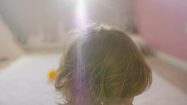 Close-up of little girl playing in her room