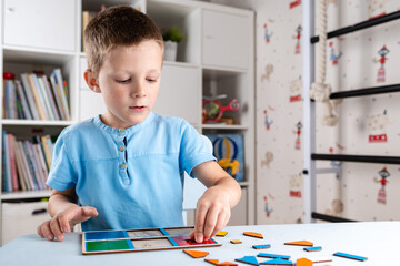 boy playing puzzle
