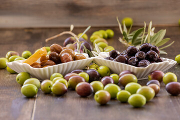 Olives on the wooden background