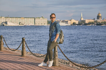 Tourist on the embankment of the Neva River in St. Petersburg, Russia.