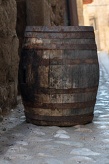 barrel of wine  with wooden log in beautiful village