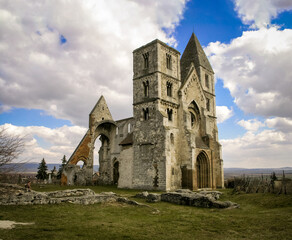 Fototapeta na wymiar Medieval, romanesque church under a cloudy sky.