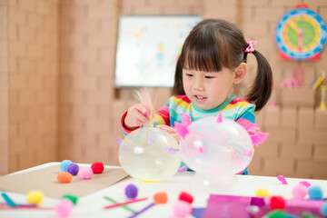 young  girl  making craft for homeschooling