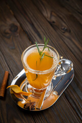 Hot mulled wine on a wooden table
