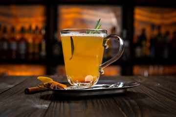 Hot mulled wine on a wooden table
