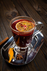 Hot mulled wine on a wooden table
