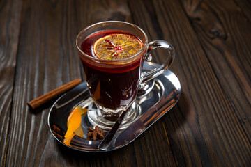 Hot mulled wine on a wooden table
