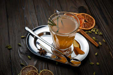 Hot mulled wine on a wooden table
