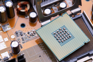 close up view for cpu or central processor chip over circuit board background. electronic industry conceptual. studio shot