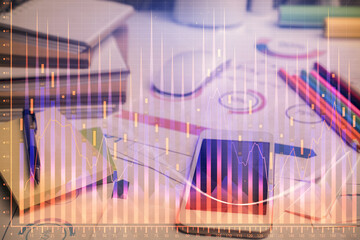 Double exposure of forex chart drawing and cell phone background. Concept of financial data analysis