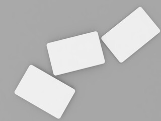 Three white business cards mock up on a gray background. 3d render illustration.