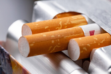 Open new pack of cigarettes close up