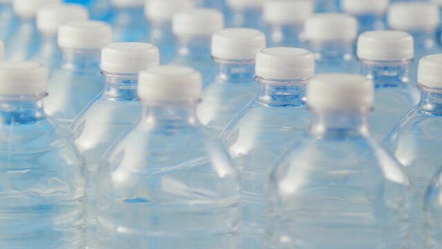 Shot of plastic bottles full of still water