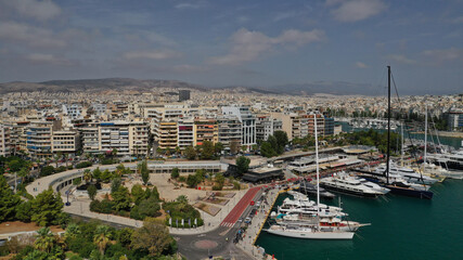 Fototapeta premium Aerial drone panoramic photo of iconic round port and marina of Zea in the heart of Piraeus with beautiful sky and clouds, Attica, Greece