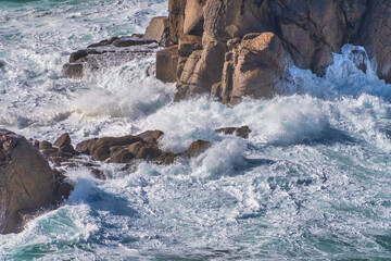 Coastline around Lands End in Cornwall England on a windy day and rough seas