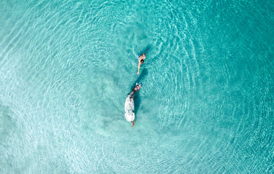 Aerial View Of Person Swimming With Horse In The Ocean, Colombia