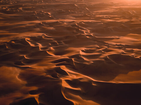 Aerial abstract view of sand dunes in Abu Dhabi, United Arab Emirates.