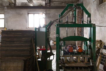 Industrial production of building cement pressed materials. Hydraulic press for pressing high quality hollow concrete block or cement brick from cement mortar.