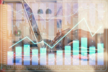 Double exposure of woman hands typing on computer and forex chart hologram drawing. Stock market invest concept.