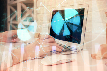 Double exposure of woman hands typing on computer and forex chart hologram drawing. Stock market analysis concept.