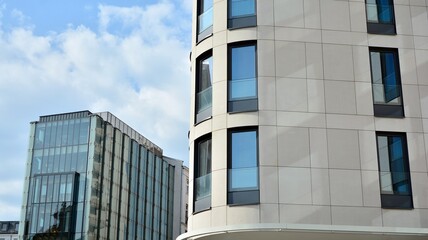 A fragment of the sandstone facade of a modern office building. Wide abstract fragment of modern building facade.