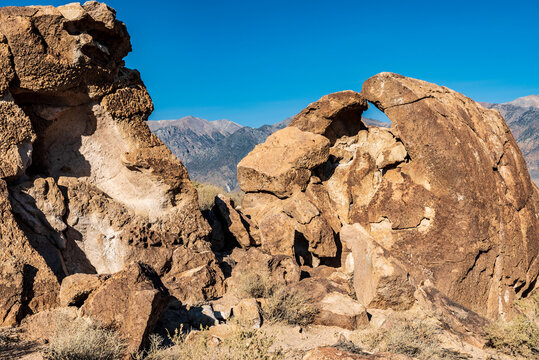 rock formations in desert valley with distant mountains extreme terrain in California