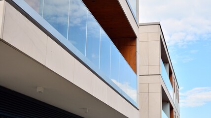 Estate property and condo architecture. Fragment of modern residential flat with apartment building exterior. Detail of new luxury home complex. 