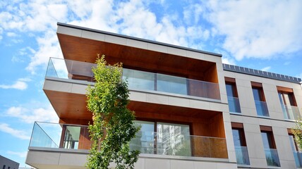 Fototapeta premium Estate property and condo architecture. Fragment of modern residential flat with apartment building exterior. Detail of new luxury home complex. 