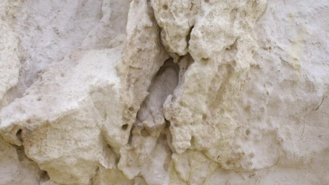 Different shaped holes in a sandstone