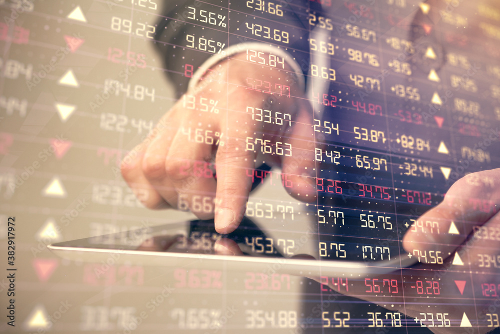 Poster multi exposure of man's hands holding and using a phone and financial chart drawing. market analysis