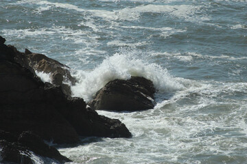 waves crashing on rocks