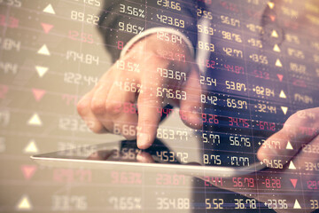 Multi exposure of man's hands holding and using a phone and financial chart drawing. Market...