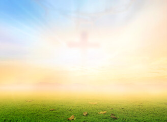 Ascension day concept: Blurred cross on meadow autumn sunrise background	