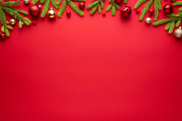 Christmas or New Year red background with fir decor