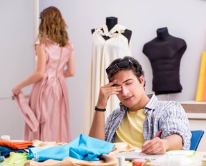 Young tailor working in his workshop