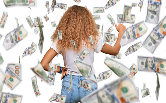 Beautiful caucasian teenager girl wearing casual white tshirt posing backwards pointing ahead with finger hand