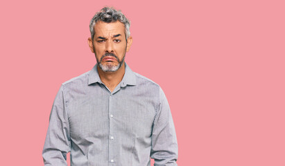 Obraz premium Middle age grey-haired man wearing casual clothes depressed and worry for distress, crying angry and afraid. sad expression.