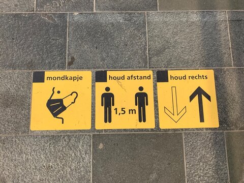 1,5 meter social distancing ( houd afstand), mandatory face masks ( mondkapje) wearing and keep right direction (houd rechts) signs at Utrecht train station. Utrecht / Netherlands.