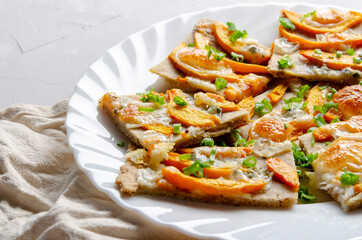 Tart from chopped dough with nuts with pumpkin, gorgonzola cheese.