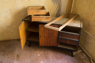 Broken furniture in apartment of ghost town Pripyat