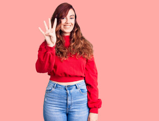 Young beautiful woman wearing casual winter sweater showing and pointing up with fingers number four while smiling confident and happy.