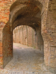 Italy, Marche, Corinaldo, part of the ancient city wall with one of the entry city door.