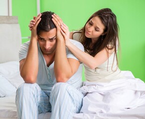 Young woman consoling disappointed impotent husband