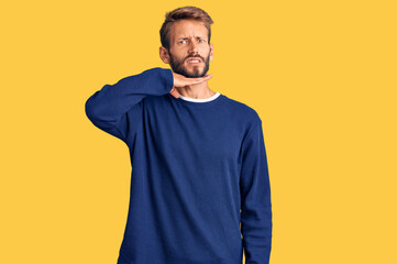 Handsome blond man with beard wearing casual sweater cutting throat with hand as knife, threaten aggression with furious violence