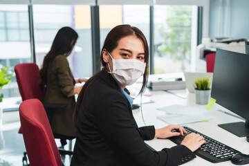 Asian business people wear face mask new normal in office meeting room