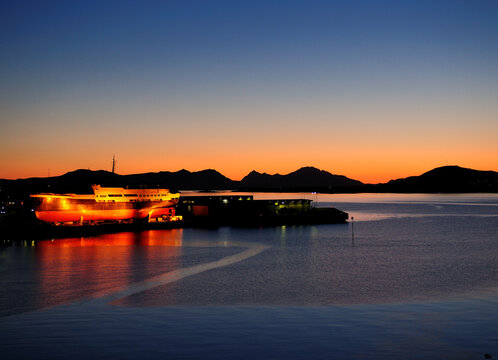 Sunset In Stokmarknes On Vesteralen Islands At Dusk On A Sunny Summer Day With A Clear Blue Sky
