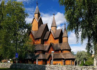 View To The Largest Stave Church Of Norway In Heddal On A Sunny Summer Day With A Clear Blue Sky And A Few Clouds
